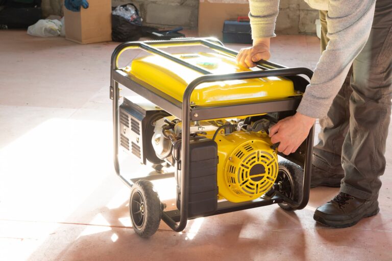 a yellow power generator on wheels in a backyard