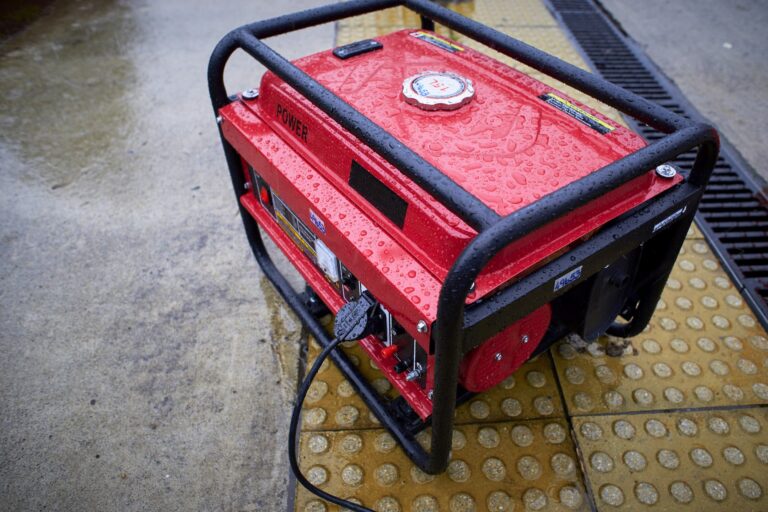 red generator in the rain on the sidewalk